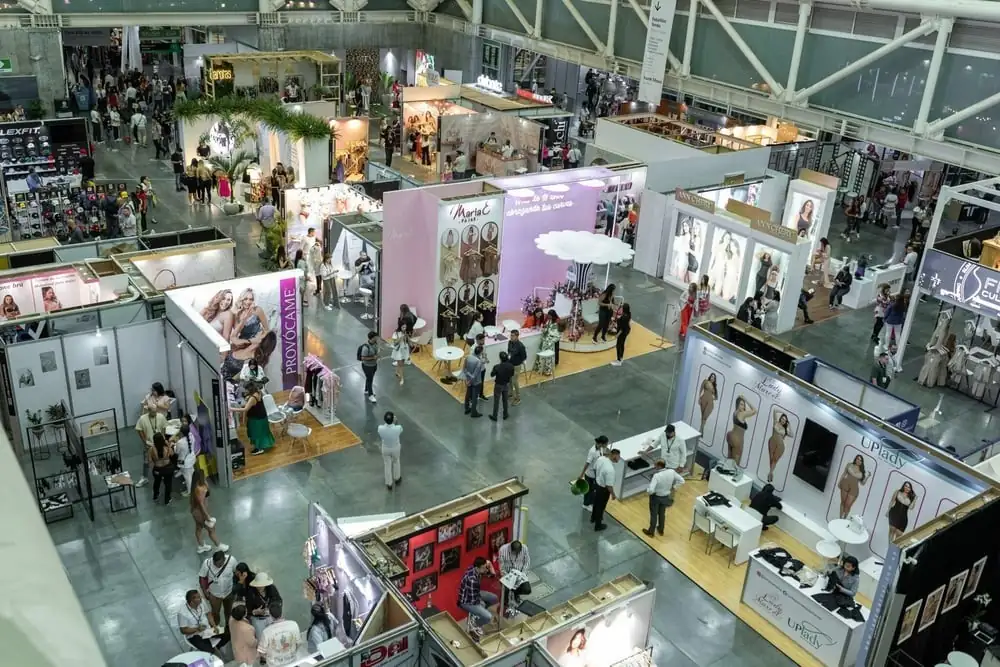 Overhead view of an apparel trade show floor with exhibitor booths