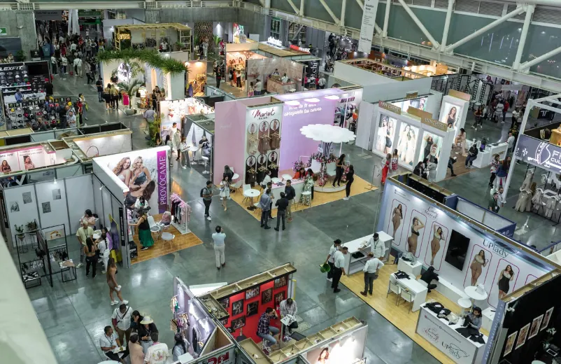 Overhead view of an apparel trade show floor with exhibitor booths