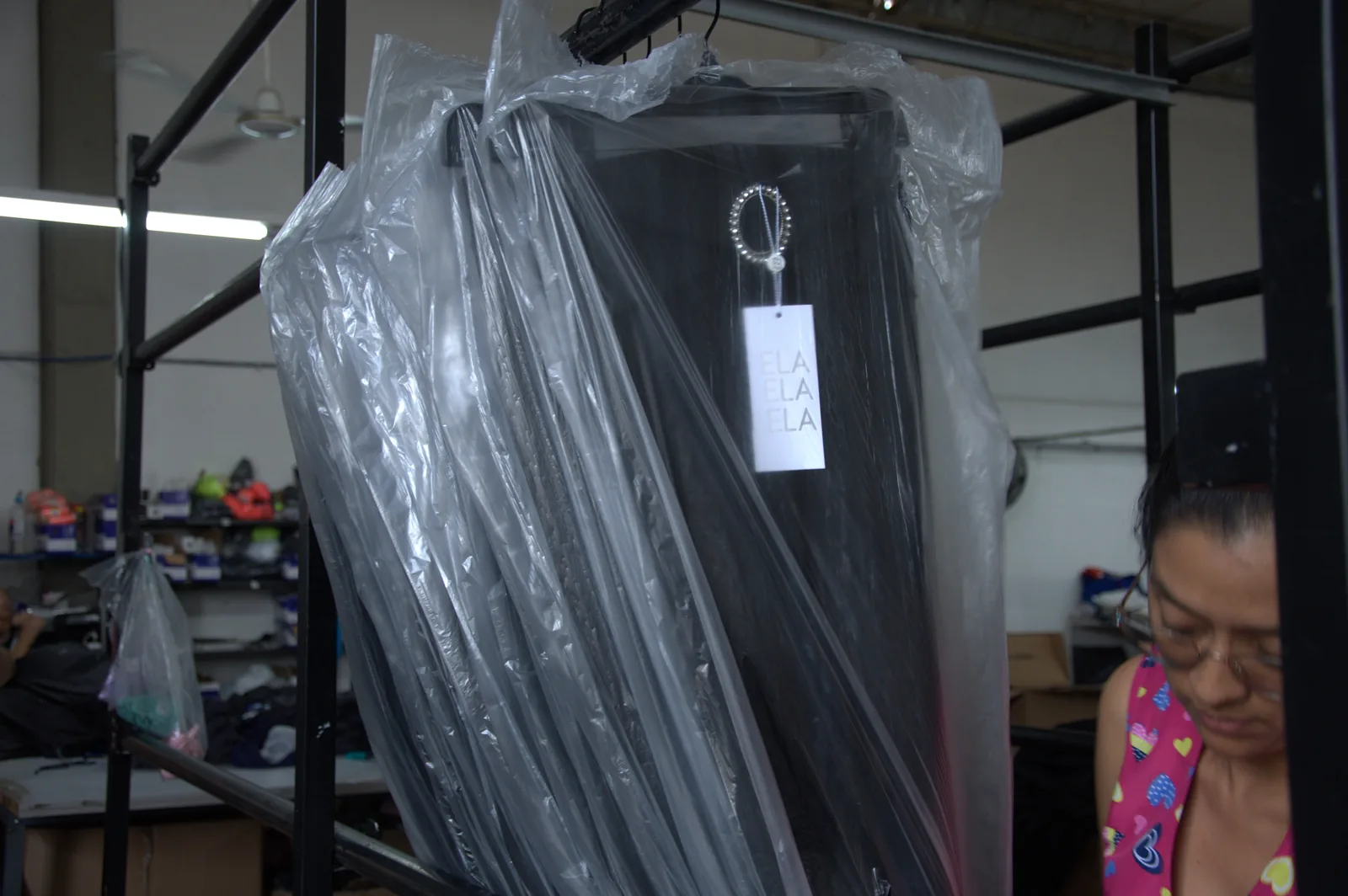 Finished garment with its brand hangtag, individually wrapped in protective plastic before dispatch