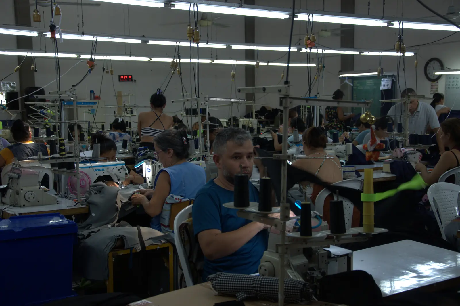 Wide view of the GAT sewing floor with operators working at their machines